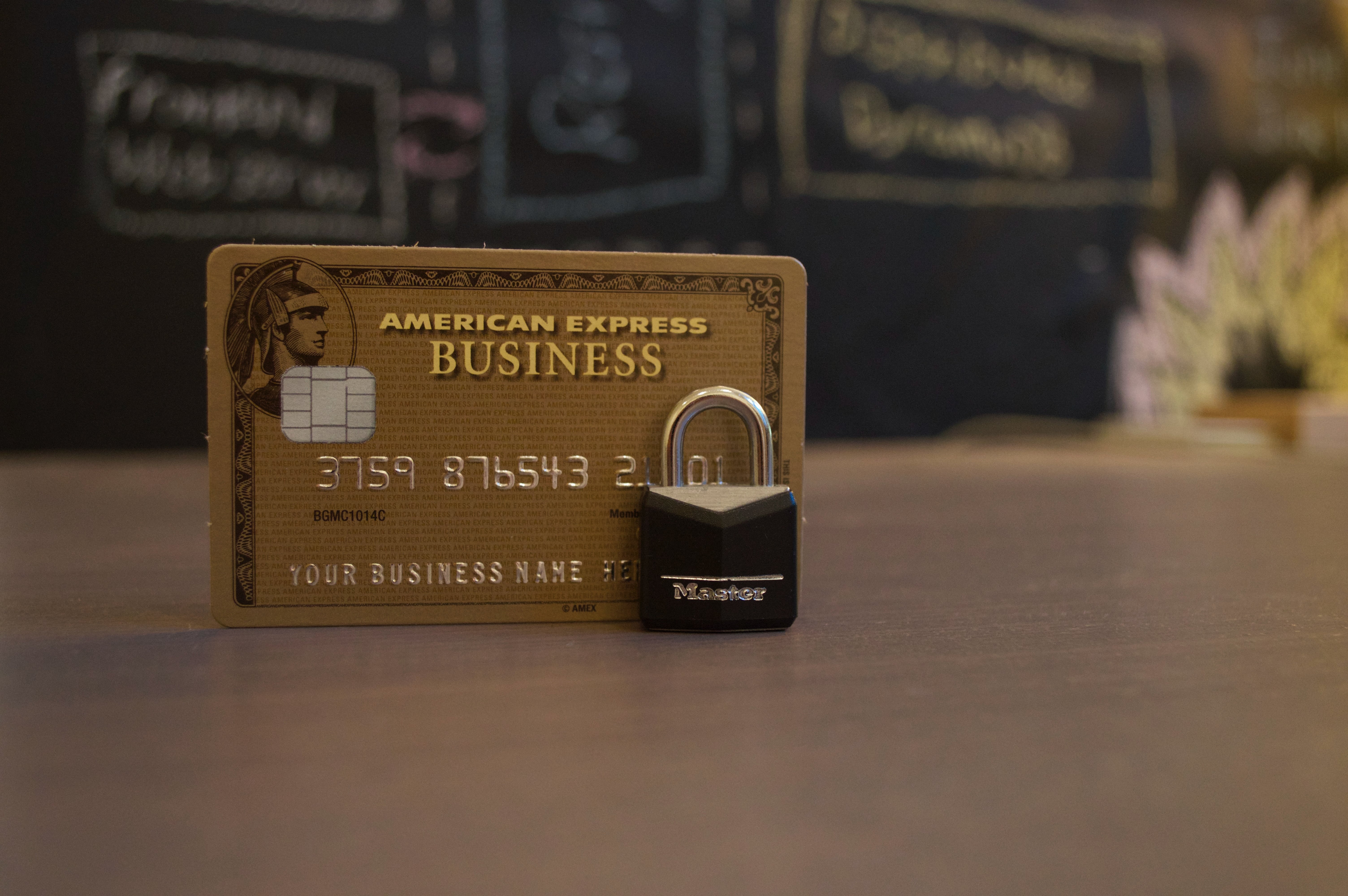 American Express credit card with master lock in front
